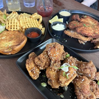Courthaus Social - wings (thai chili sauce), Courthaus Burger (left), Schnitzel (right) - Sports Bars Near Me - Arlington, Virginia