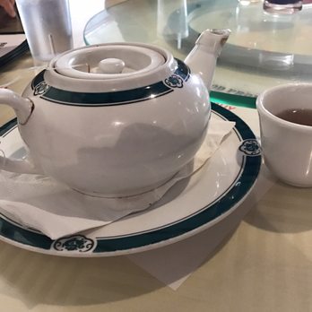 Ming's Bistro - Jasmine tea in pot. Strainer in pot so a few loose leaves. Very good! - Dim Sum Near Me - Orlando, Florida