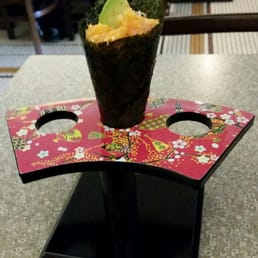 Spicy salmon hand roll.