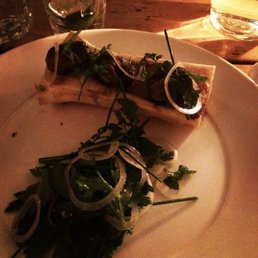 Bone marrow with escargot and a parsley salad. Bone marrow with escargot and a parsley salad.