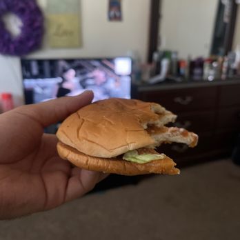 McDonald's - a hand holding a chicken sandwich - Burgers Near Me - El Cajon, California McDonald's - a hand holding a chicken sandwich - Burgers Near Me - El Cajon, California