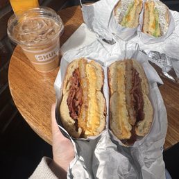 Bacon egg & cheese on a toasted jalapeno cheddar bagel Iced coffee with added creamer Juice Bacon egg & cheese on a toasted jalapeno cheddar bagel Iced coffee with added creamer Juice