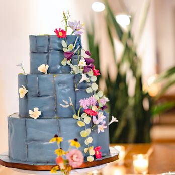 Sugar Couture - a blue wedding cake with flowers - Bakeries Near Me