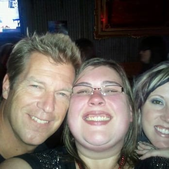 Twisted Bull - a man and two women posing for a picture - Beer Bar Near Me - Grand Rapids, Michigan