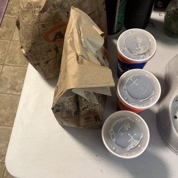 A&W - a table with cups and a bag of food - Fast Food Near Me - Mill Bay, British Columbia A&W - a table with cups and a bag of food - Fast Food Near Me - Mill Bay, British Columbia