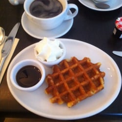 Petit Paris - Waffle with caramel syrup and cream, with a rich black coffee