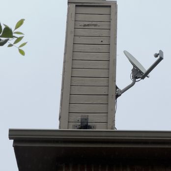 The Critter Crew - Squirrel one-way-door on the chimney base. - Wildlife Control Near Me - Dallas, Texas The Critter Crew - Squirrel one-way-door on the chimney base. - Wildlife Control Near Me - Dallas, Texas