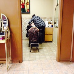 Humara's Salon - The woman who does an AMAZING job is washing my sisters hair in the back! Tip her well