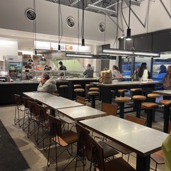 Chipotle Mexican Grill - This is how far back I m in line and they have only one person working the line.
