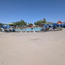 Resort pool area that can shift into nighttime concerts. Resort pool area that can shift into nighttime concerts.