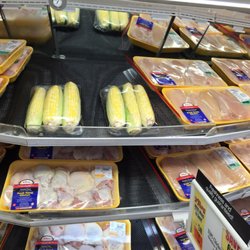 Tops Friendly Market - Vegetables in the same case as raw chicken. Really the BOH would write you up for that.