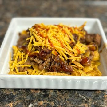 PDG Barbecue - Frito Pie! Fritos topped with our Housemade Savory Beans, meat of your choice, cheese, sauce and sour cream. Sooooo good! - Barbeque Near Me - Waco, Texas PDG Barbecue - Frito Pie! Fritos topped with our Housemade Savory Beans, meat of your choice, cheese, sauce and sour cream. Sooooo good! - Barbeque Near Me - Waco, Texas
