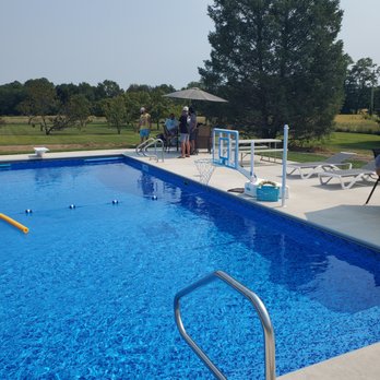 Complete pools and construction - a pool with a ladder - General Contractors Near Me Complete pools and construction - a pool with a ladder - General Contractors Near Me