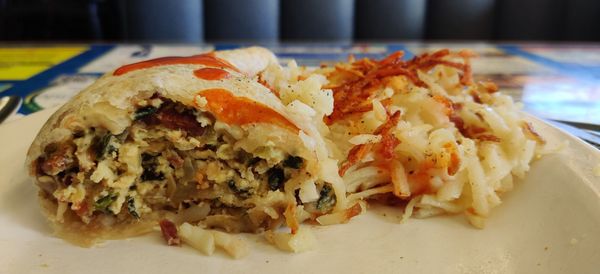 Photo of Mike & Ronda's The Place - Flagstaff, AZ, US. Egg Burrito with Spinach, Onions, Green Chili, Bacon, Pepper Jack Cheese