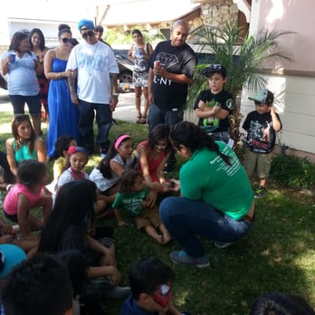 Reptacular Animals - Natalie showing the kids a frog I believe. Great show! - Party & Event Planning Near Me - Sun Valley, California