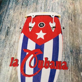 La Cubana - a surfboard on a wooden surface - Cuban Near Me - Marietta, Georgia