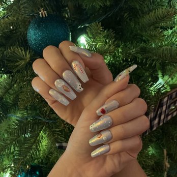Coco Luxe Nails - Baby Blue under coat with fairy dust and Christmas designs - Eyelash Service Near Me - Santa Monica, California Coco Luxe Nails - Baby Blue under coat with fairy dust and Christmas designs - Eyelash Service Near Me - Santa Monica, California
