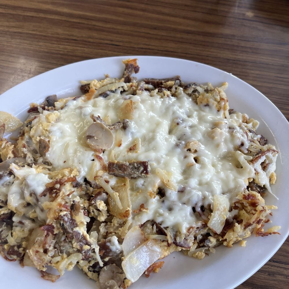 Greek Hobo. Mushrooms, Greek sausage, onions, peppers, hash browns and topped with feta cheese. It's really good with the fresh salsa. Greek Hobo. Mushrooms, Greek sausage, onions, peppers, hash browns and topped with feta cheese. It's really good with the fresh salsa.