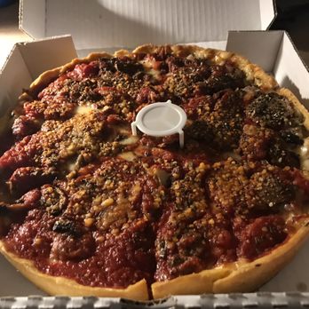 Tony's Chicago Style Pizzeria - Food - Tony's 10" Deluxe Chicago Style Deep Dish that has sausage, onions, mushrooms and pepperonis - Pizza Near Me - Moline, Illinois