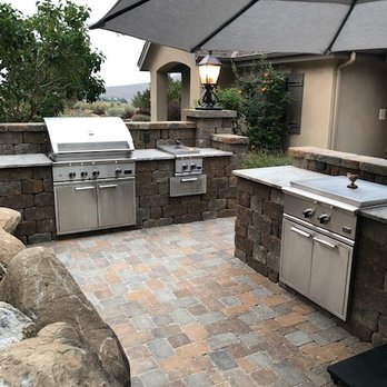 Pavers By Porter - an outdoor kitchen with a grill and umbrella - General Contractors Near Me - Sparks, Nevada Pavers By Porter - an outdoor kitchen with a grill and umbrella - General Contractors Near Me - Sparks, Nevada