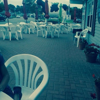 Molly Moos - The outside! You can't miss the cow, and it shares a parking lot with the Chamber of Commerce. - Ice Cream & Frozen Yogurt Near Me - St. Ignace, Michigan
