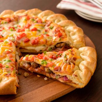 Papa Murphy's - a sliced pizza on a cutting board - Pizza Near Me - Issaquah, Washington Papa Murphy's - a sliced pizza on a cutting board - Pizza Near Me - Issaquah, Washington