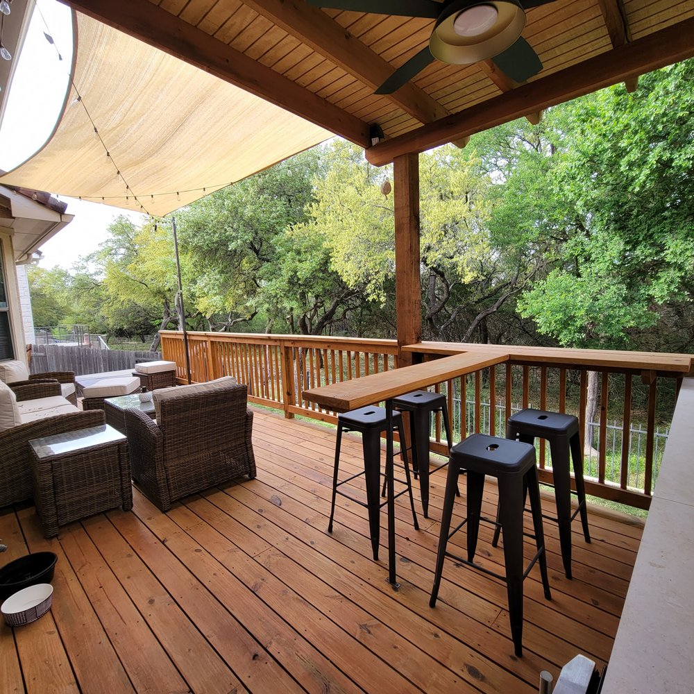 Rockview Landscapes - a patio with a table and chairs - Landscaping Near Me - Bee Cave, Texas Rockview Landscapes - a patio with a table and chairs - Landscaping Near Me - Bee Cave, Texas