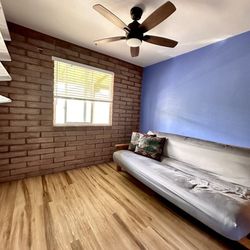 Brandi R Levy - A bedroom that Brandi helped us pack up and stage for real estate photos.