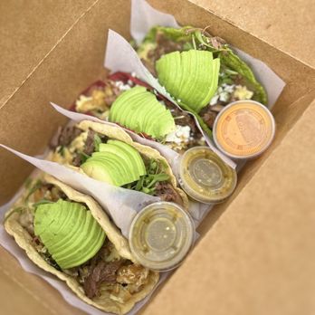 La Santa Barbacha - Two barbacoa  migas and two barbacoa breakfast tacos. - Mexican Near Me - Austin, Texas