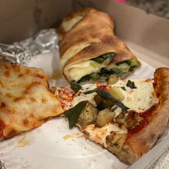 Piezano's - cross-section of Spinach and Broccoli Roll, regular Melanzane Pizzette slice, and what's left of a Sicilian Slice Pizza - Italian Near Me - Northport, New York