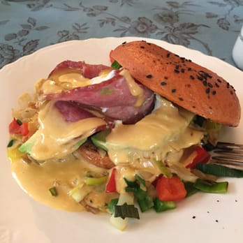 Locust Street Inn - 'Southwest Peak', candied onion, leeks, bell-peppers, turkey bacon wrapped around poached egg, on homemade Bagel, topped with Mornay sauce! - Hotels Near Me - Denton, Texas