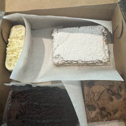 Lemon square, chocolate cake, chocolate brownie and a raspberry almond cake Lemon square, chocolate cake, chocolate brownie and a raspberry almond cake