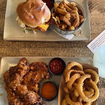 Kelsey's - Chicken thighs and onion rings and a burger with poutine - American Near Me - Niagara Falls, Ontario