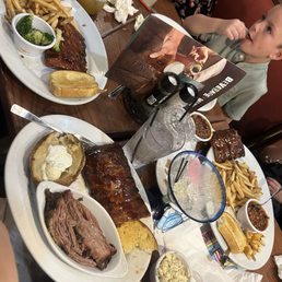 Baby ribs with baked potato and brisket