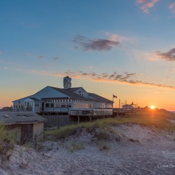 Casino Bar - the sun setting on the beach - American Near Me - Davis park, New York