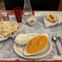 Chicken Makhani, rice, Papadam with dipping sauce, Naan with Raisin & Coconut, and Diet Coke. Chicken Makhani, rice, Papadam with dipping sauce, Naan with Raisin & Coconut, and Diet Coke.