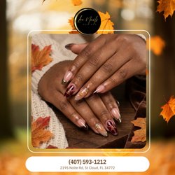Lee Nails Day Spa - Luxurious celestial wine! Glossy burgundy aura ombres pair with sleek gold chrome French smile tips and shining golden stars. Book now!