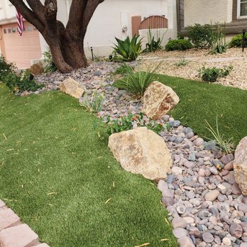 Mac Landscaping - a front yard with artificial grass and rocks - Landscaping Near Me - Las Vegas, Nevada Mac Landscaping - a front yard with artificial grass and rocks - Landscaping Near Me - Las Vegas, Nevada
