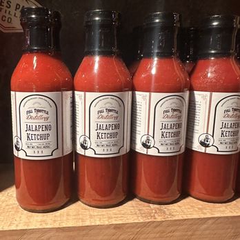 Bob & Tony's Pizza - a row of bottles of jalapeno ketchup - Pizza Near Me - Estes Park, Colorado