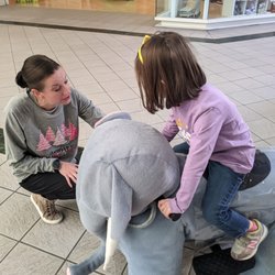Staff helping my daughter with a ride on animal