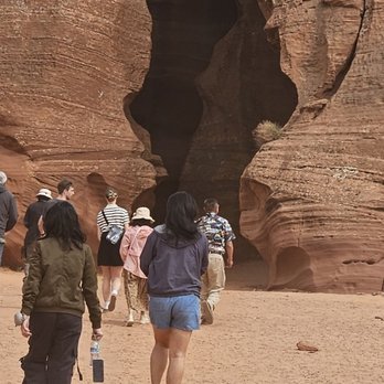 Antelope Slot Canyon Tours - Walking in to the canyon, upper. - Tours Near Me - Page, Arizona Antelope Slot Canyon Tours - Walking in to the canyon, upper. - Tours Near Me - Page, Arizona