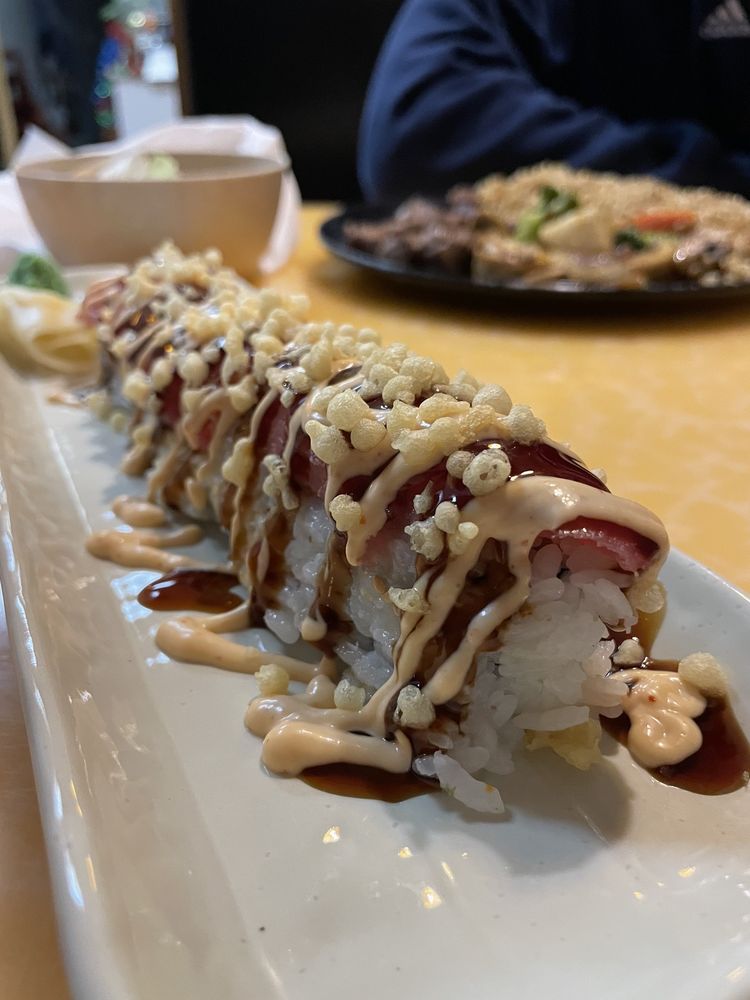 Playboy roll sushi with fresh ingredients and signature sauces.