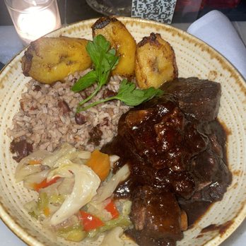 Las' Lap - Oxtail with Rice and Peas and cabbage - Caribbean Near Me - New York, New York Las' Lap - Oxtail with Rice and Peas and cabbage - Caribbean Near Me - New York, New York