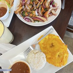EL Colombiano - Pollo Saltado, with rice and beans and tostones.