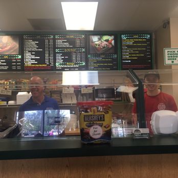 Deli Boy Subs - Tom the owner on the left hand side & menu board above - Delis Near Me - Davie, Florida Deli Boy Subs - Tom the owner on the left hand side & menu board above - Delis Near Me - Davie, Florida