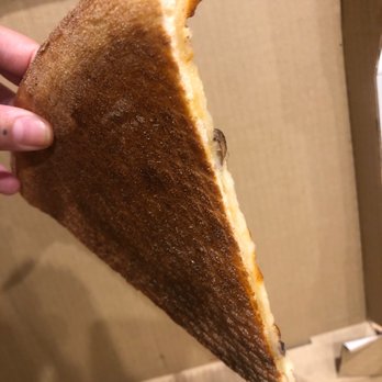 Roma's Pizza - a hand holding a slice of pizza - Pizza Near Me - Oceanside, California Roma's Pizza - a hand holding a slice of pizza - Pizza Near Me - Oceanside, California