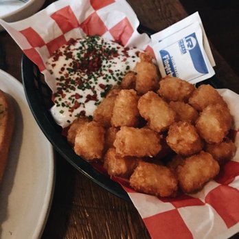 The Snug - TATER TOTS horseradish sour cream, "bacon", chive - Cocktail Bars Near Me - San Francisco, California The Snug - TATER TOTS horseradish sour cream, "bacon", chive - Cocktail Bars Near Me - San Francisco, California