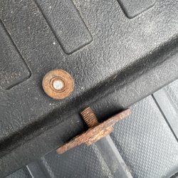 Wymers Auto Repair - Sheered bolt to battery tie down after attempting to unscrew the nut.