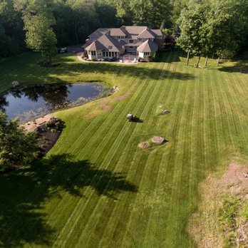 Haraden Landscaping - Mowing is our main service, shown in this picture. Owner Jack Haraden mowing his client in Rye, with a Walker Mower. - Landscaping Near Me
