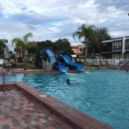 Swimming pool area with two water slides Swimming pool area with two water slides